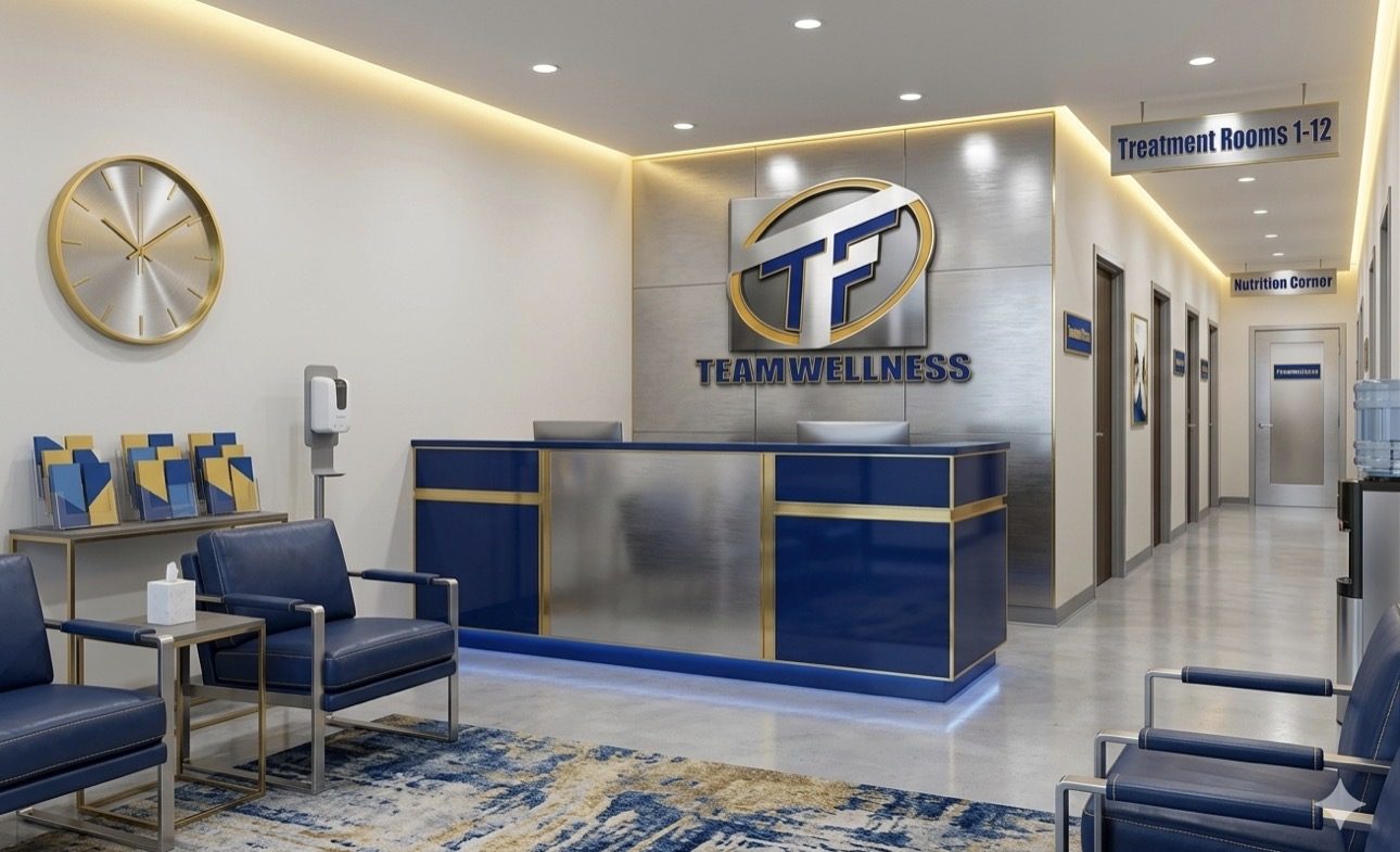 Team Wellness clinic reception in Lake Stevens with navy and gold branding